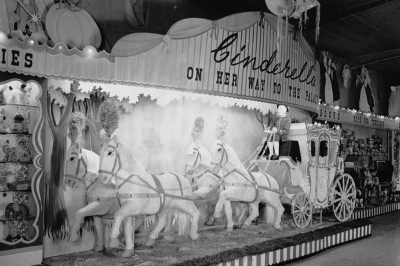 Cinderella’s carriage drawn by six white horses at Blackler’s toy fair at Fleet Street Warehouse, Christmas 1949.