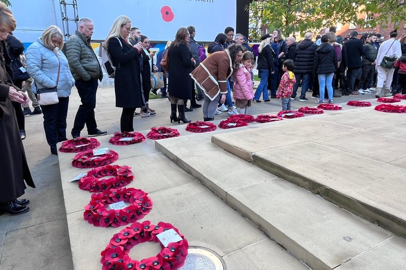 Following the Remembrance Sunday service, members of the public were able to pay their respects and lay their own wreaths at the War Memorial on St. Peter’s Square. Credit: Manchester World