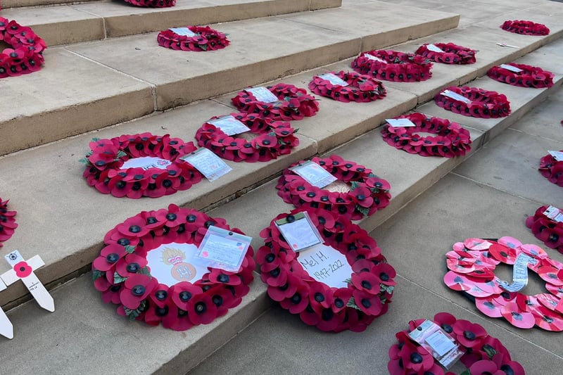 Poppy wreaths on the steps of the War Memorial on St Peter’s Square on Remembrance Sunday. Credit: Manchester World. 