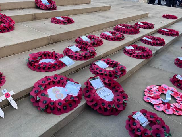Poppy wreaths on the steps of the War Memorial on St Peter’s Square on Remembrance Sunday. Credit: Manchester World. 