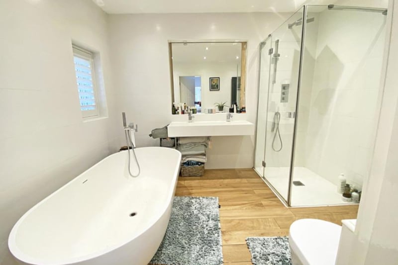 The master bedroom en suite has a free standing bath and walk-in shower.
