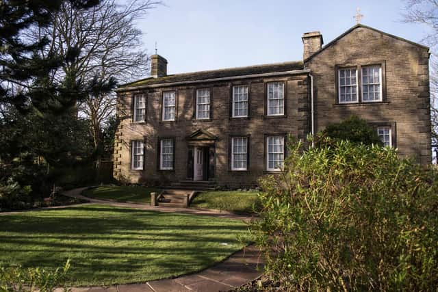 An exterior view of the Bronte Parsonage Museum, the former home of the Bronte family and the place where their novels were written, in Haworth, northern England on February 16, 2018. - This year marks the bicentenary of the birth of Emily Bronte, the author of 'Wuthering Heights', and also the 90th anniversary of the opening of the Bronte Parsonage Museum. The museum houses the world's largest collection of Bronte manuscripts, furniture and personal possessions, and welcomed over 85,000 visitors. (Photo by OLI SCARFF / AFP) (Photo by OLI SCARFF/AFP via Getty Images)