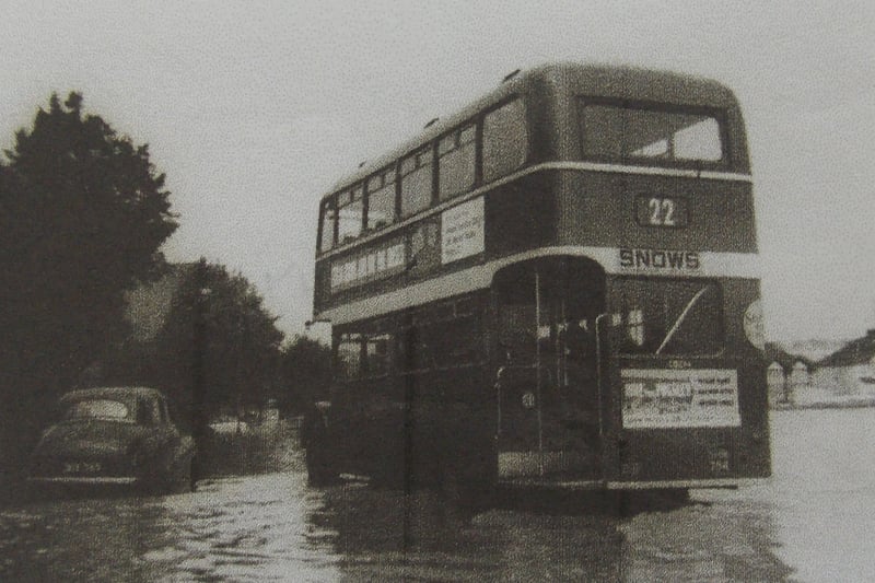 A 22 Bus in Ashton wades through the flood water.