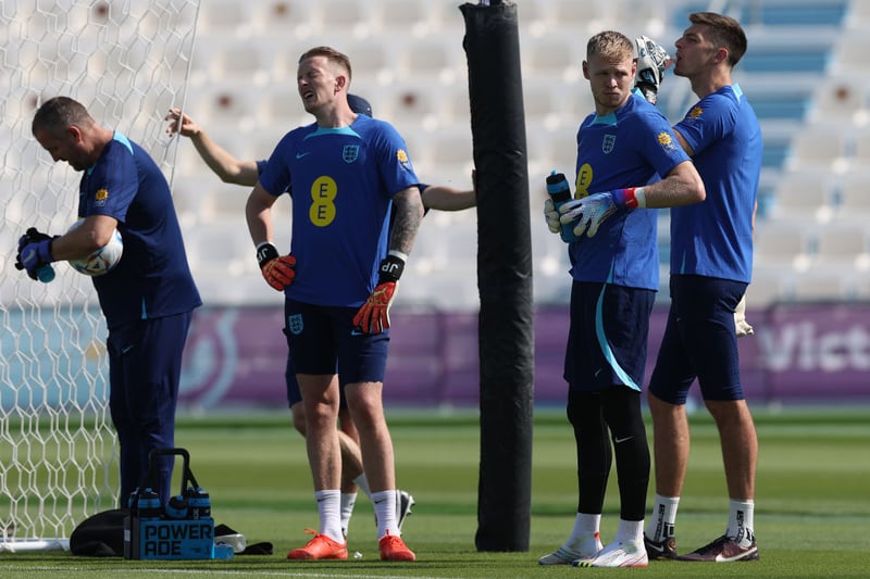 England goalkeepers Jordan Pickford (l), Aaron Ramsdale (c) and Nick Pope (r) take a breather during the England Training Session at Al Wakrah Stadium on November 18, 2022 in Doha, Qatar. (Photo by Michael Steele/Getty Images)