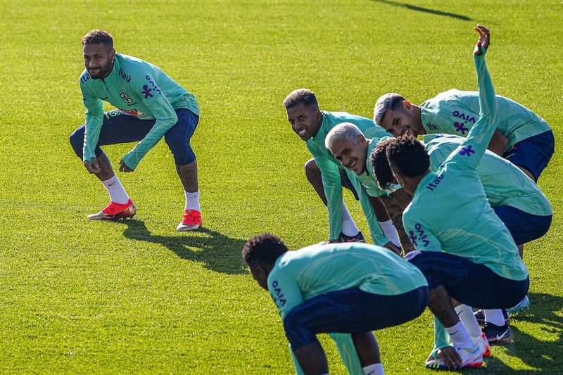 (From L) Brazil's forward Neymar, Brazil's forward Rodrygo, Brazil's forward Pedro and Brazil's midfielder Bruno Guimaraes stretch during a training session on November 18, 2022 at the Continassa training ground in Turin, as part of Brazil's preparation ahead of the Qatar 2022 World Cup. (Photo by Isabella BONOTTO / AFP) (Photo by ISABELLA BONOTTO/AFP via Getty Images)
