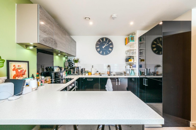 The modern kitchen with a breakfast bar to provide another space for eating 