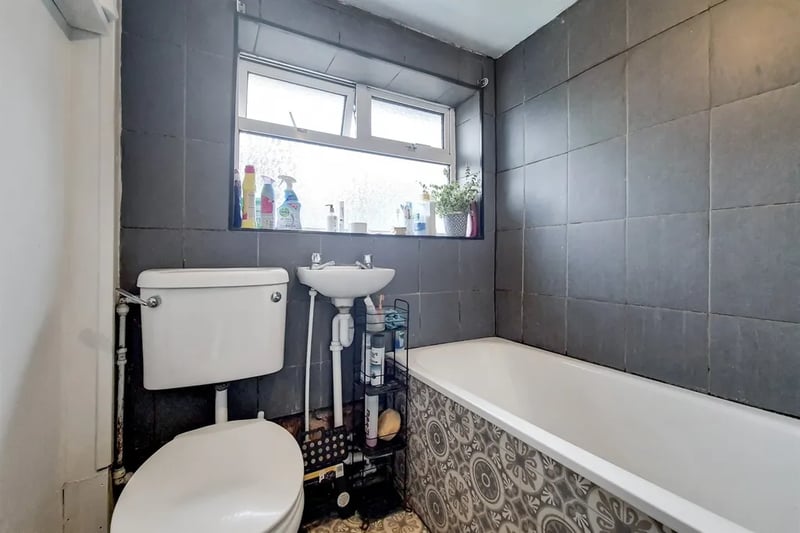 The bathroom features a combined bath/shower unit, simple hand basin and the “throne” for first time buyers to lay claim to