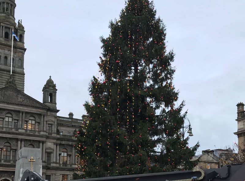 Lord Provost of Glasgow, Jacqueline McLaren, hold the final bauble to place on the George Square Christmas Tree