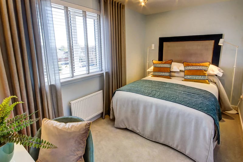 Bedroom 2 is furnished with a comfortable and stylish carpet with desk space for work