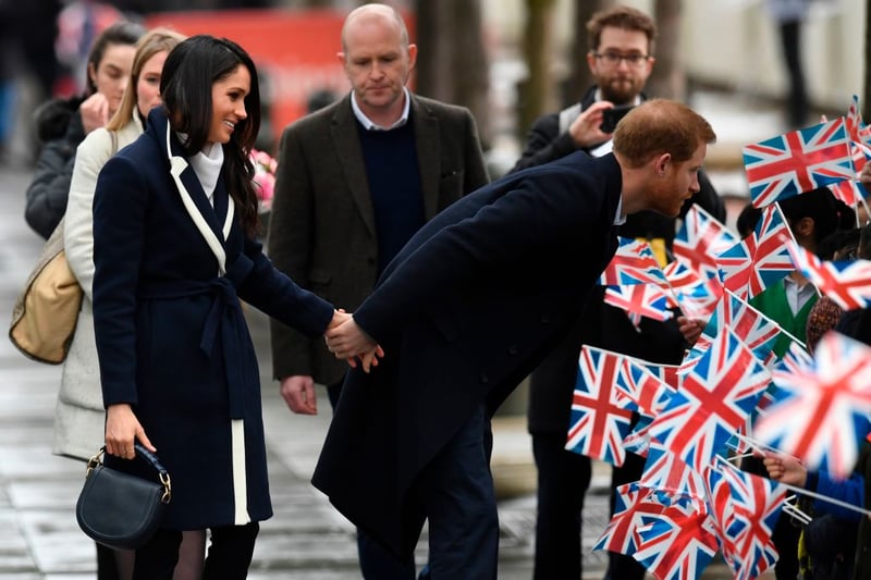 Britain’s Prince Harry (R) and Meghan Markle (L) greet well-wishers (Photo credit - PAUL ELLIS/AFP via Getty Images)