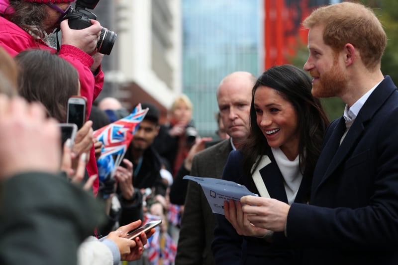 Prince Harry and Meghan Markle talk to local people during a visit on March 8, 2018 in Birmingham, England.  (Photo by Hannah McKay-WPA Pool/Getty Images)