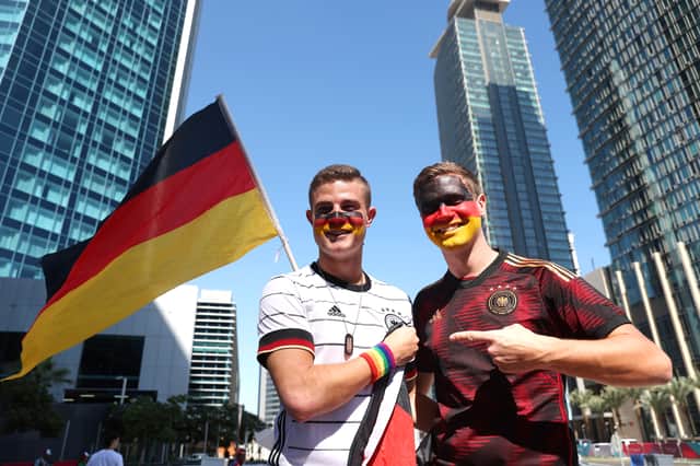 Germany fans pose for a photo as they wear a Rainbow wristband (Getty Images)