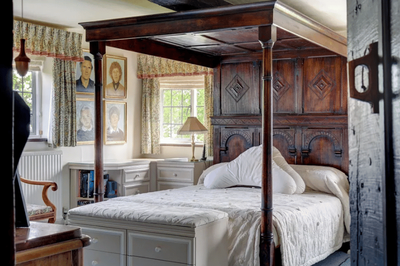 Double bedroom with four-poster bed inside the mansion.