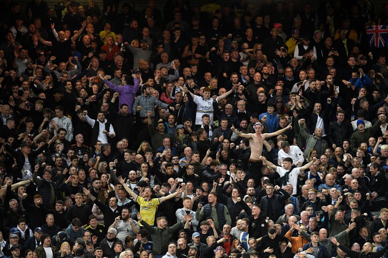 Leeds fans celebrate after the final whistle of the English Premier League football match between Liverpool and Leeds United at Anfield in Liverpool, north west England on October 29, 2022. 