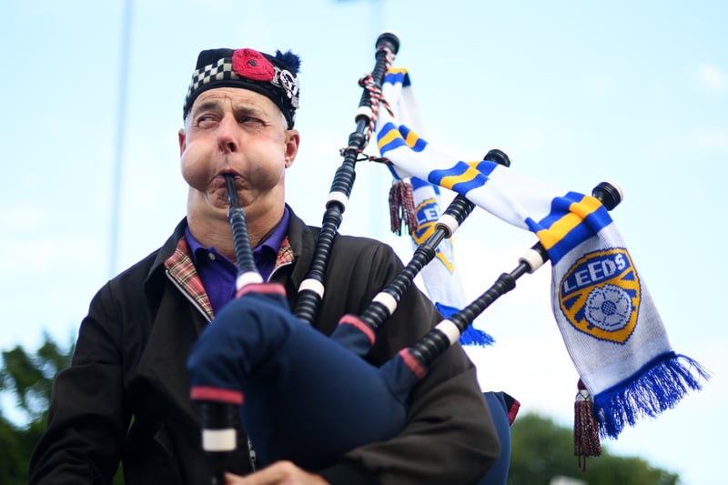 A Leeds United fan plays the bagpipes outside the stadium prior to the Premier League match between Leeds United and Everton FC at Elland Road on August 30, 2022.