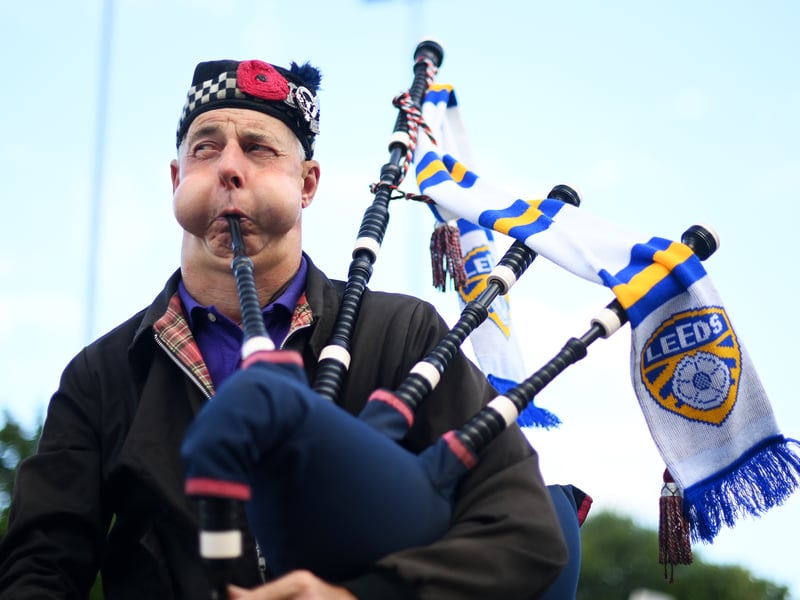A Leeds United fan plays the bagpipes outside the stadium prior to the Premier League match between Leeds United and Everton FC at Elland Road on August 30, 2022.
