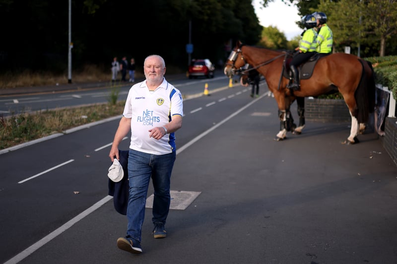 A Leeds United fan arrives at the stadium prior to the Premier League match between Leeds United and Everton FC at Elland Road on August 30, 2022.