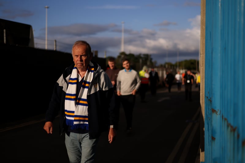 A Leeds United fan arrives at the stadium prior to the Premier League match between Leeds United and Everton FC at Elland Road on August 30, 2022 in Leeds, England. 