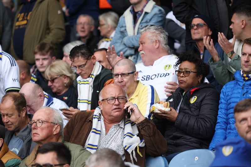 Leeds United fans look on as kick off is delayed due to a technical issue during the Premier League match between Leeds United and Arsenal FC at Elland Road on October 16, 2022 .
