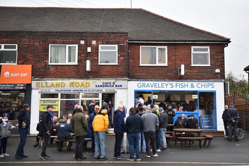 Leeds United fans enjoy the pre match atmosphere at a cafe outside the stadium prior to the Premier League match between Leeds United and AFC Bournemouth at Elland Road on November 05, 2022.