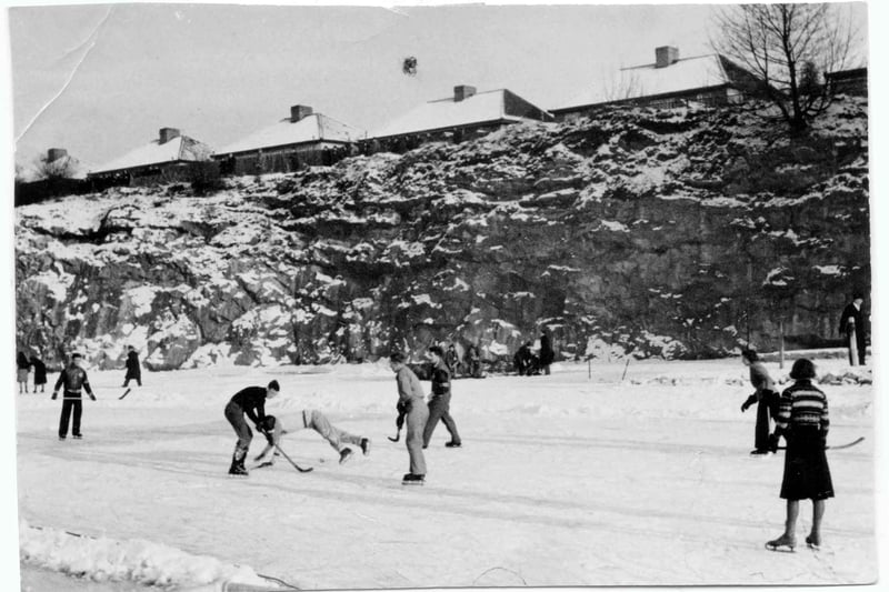 An Impromptu game of ice hockey breaks out on the frozen water. Irene Ruth Moreton, member of the Henleaze Swimming Club, captured the images from the frozen lake.