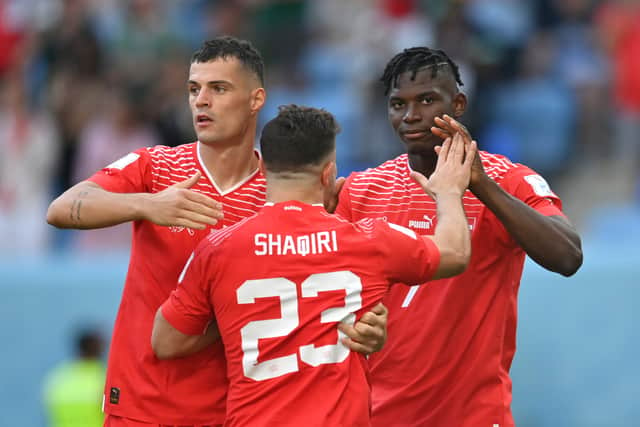 Breel Embolo (R) of Switzerland celebrates scoring their first goal with their teammates Granit Xhaka (L) and Xherdan Shaqiri (Getty Images)