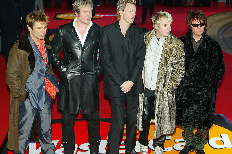 Duran Duran pose for pictures as they arrives for the Brit Awards, the British music awards, 17 February, 2004 in London. They were the winners of the Outstanding Contribution to Music award. (Photo credit - ALESSANDRO ABBONIZIO/AFP via Getty Images)
