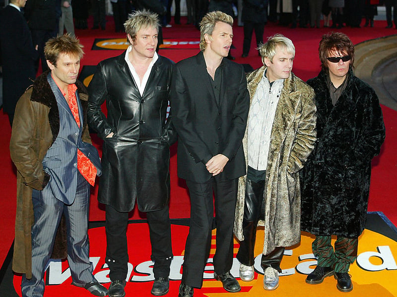 Duran Duran pose for pictures as they arrives for the Brit Awards, the British music awards, 17 February, 2004 in London. They were the winners of the Outstanding Contribution to Music award. (Photo credit - ALESSANDRO ABBONIZIO/AFP via Getty Images)