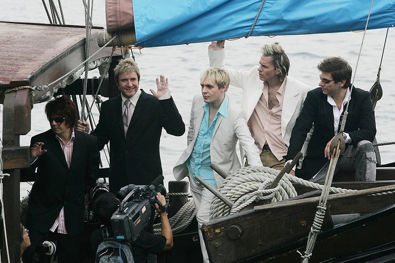  Duran Duran have their pictures taken during a promotional album tour on a boat in Hong Kong, 26 August 2004 (Photo credit - MIKE CLARKE/AFP via Getty Images)