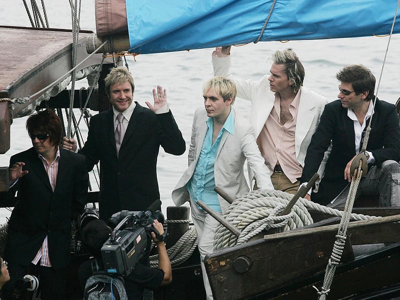  Duran Duran have their pictures taken during a promotional album tour on a boat in Hong Kong, 26 August 2004 (Photo credit - MIKE CLARKE/AFP via Getty Images)