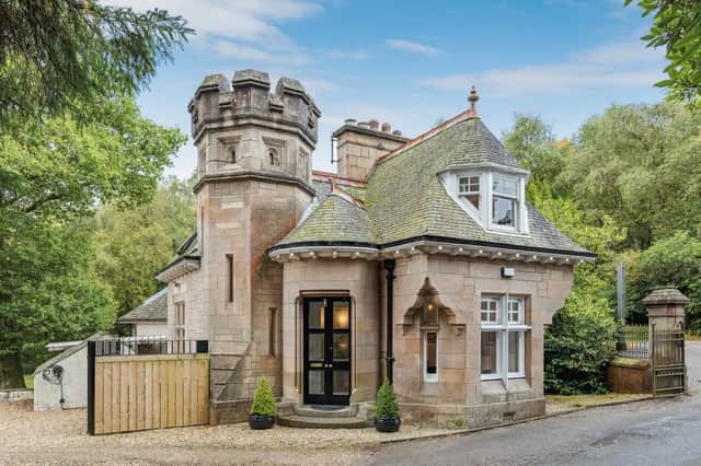 The unusual property is made from traditional blonde sandstone and includes an ornamental turret