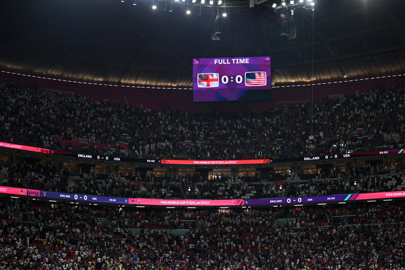  The LED board shows the final score among a packed Al Bayt Stadium.