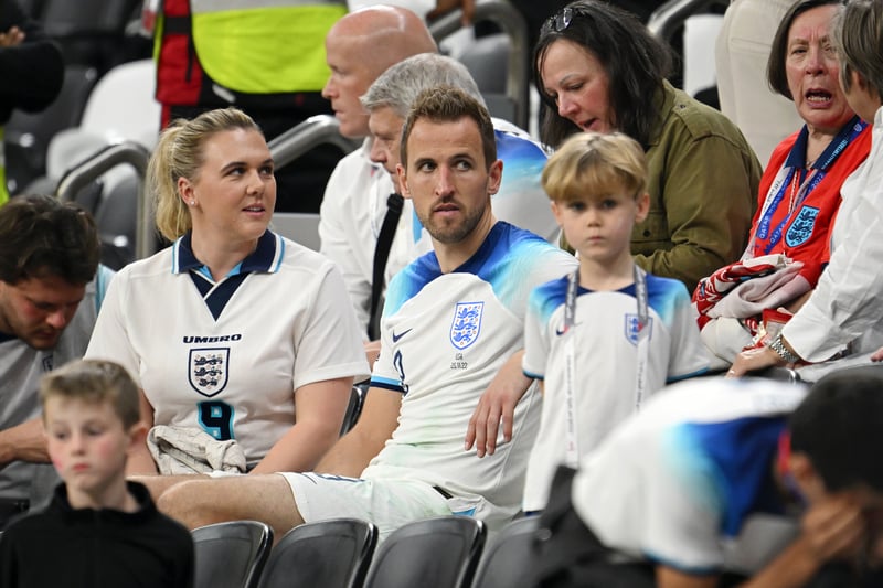 Harry Kane of England interacts with their partner Katie Goodland.