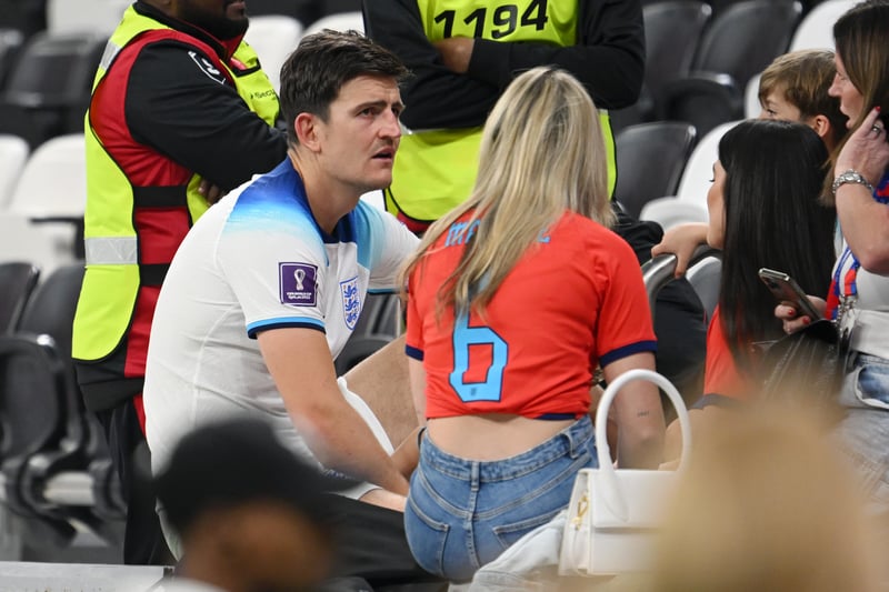 Harry Maguire of England interacts with their family members including wife Fern Hawkins. 