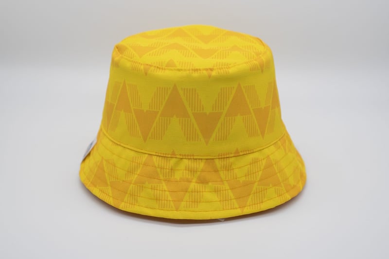 Inspired by the yellow kit Leeds wore on the day their First Division title was confirmed, you’re sure to stand out from the crowd with this reversible bucket. Available to buy at https://footballbobbles.com/product/champions-92-bucket-hat/. 