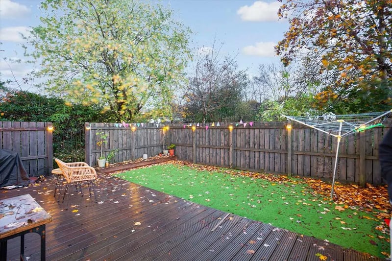 A beautifully landscaped, south-facing, sunny garden with a decked patio and well managed lawns