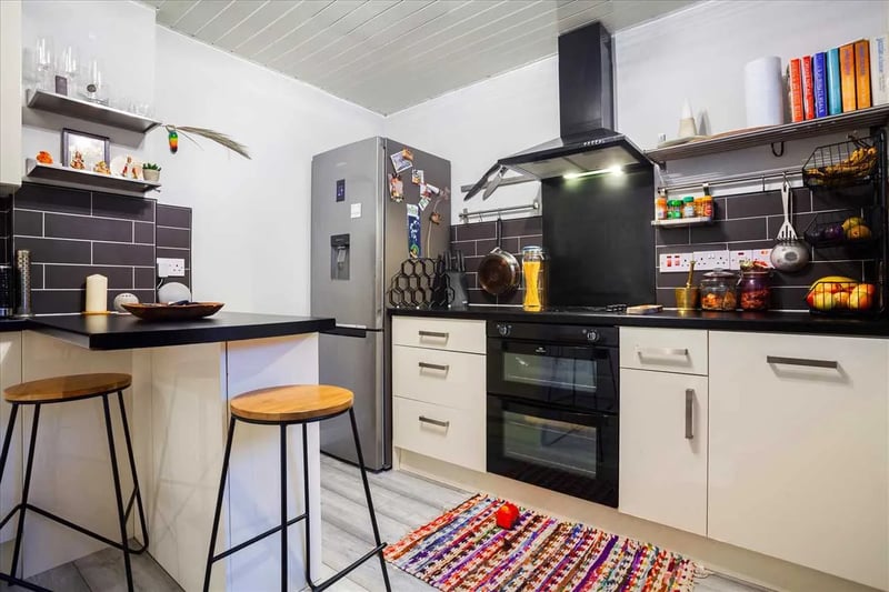 The kitchen is fitted with a range of wall and base mounted units with worktops and a breakfast area as well as a selection of integrated appliances