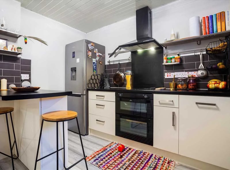 The kitchen is fitted with a range of wall and base mounted units with worktops and a breakfast area as well as a selection of integrated appliances