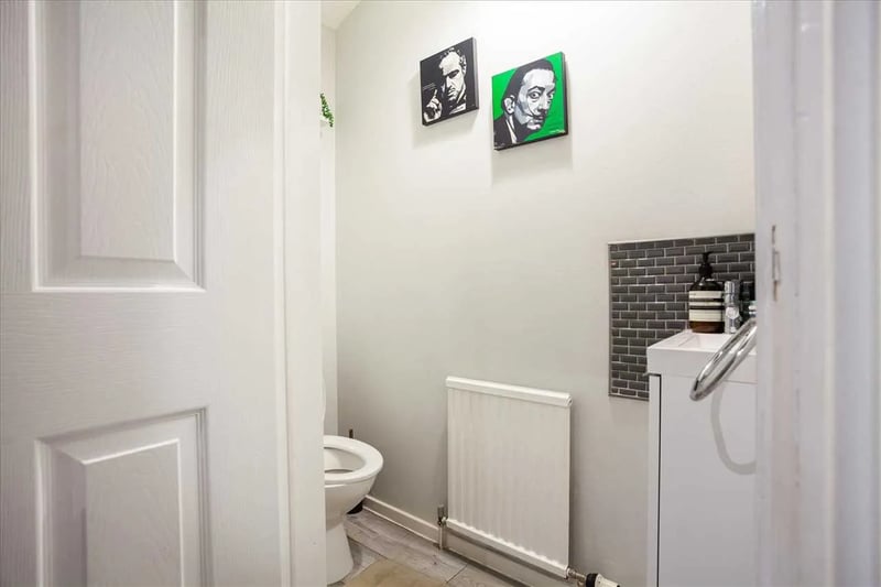 A two-piece bathroom sits on the lower floor