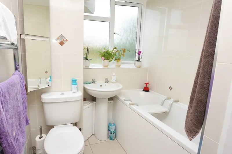 The suite bathroom has been furnished with modern fixtures, including what the estate agents describe as a “push button WC”