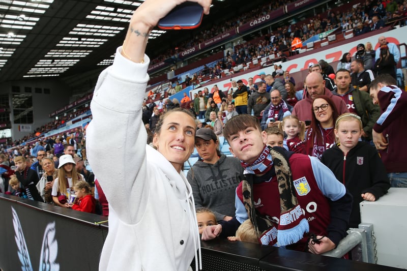 Former Professional Footballer, Jill Scott MBE takes selfie photographs with fans at half time at Villa Park on September 18, 2022.