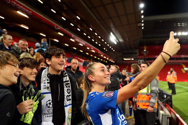Megan Finnigan of Everton takes a selfie with fans at Anfield on September 25, 2022.