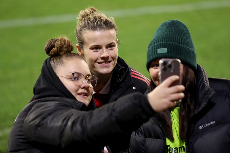 Hayley Ladd of Manchester United Women poses with fans at Leigh Sports Village on November 6, 2022.