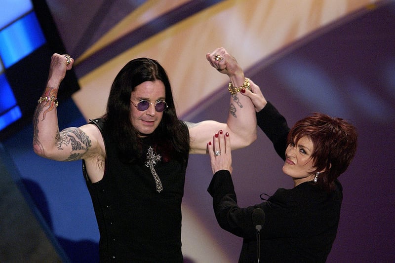 LOS ANGELES - JANUARY 13:  Hosts Ozzy and Sharon Osbourne speak on stage during the 30th Annual American Music Awards (AMA) at the Shrine Auditorium on January 13, 2003 in Los Angeles, California.  (Photo by Vince Bucci/Getty Images)