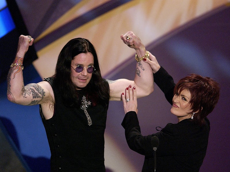 LOS ANGELES - JANUARY 13: Hosts Ozzy and Sharon Osbourne speak on stage during the 30th Annual American Music Awards (AMA) at the Shrine Auditorium on January 13, 2003 in Los Angeles, California. (Photo by Vince Bucci/Getty Images)