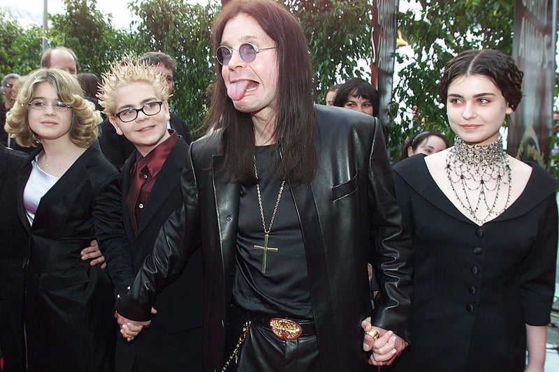 Ozzy Osbourne (C) arrives at the 42nd Grammy Awards Ceremony with his family in Los Angeles, CA, 23 February, 2000.  Osbourne’s group “Black Sabbath” won a Grammy for Best Metal Performance for the song “Iron Man” on the album “Reunion”. (Photo - LUCY NICHOLSON/AFP via Getty Images)
