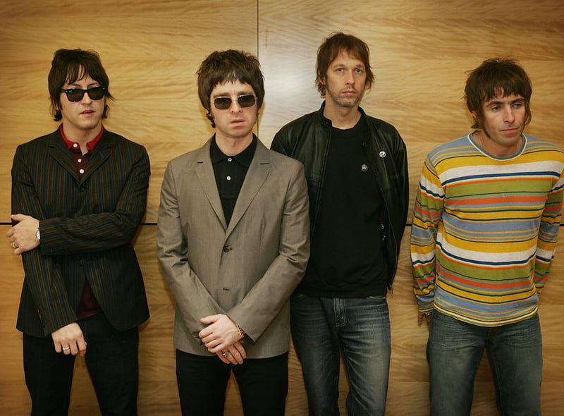 Gem Archer, Noel Gallagher, Andy Bell and Liam Gallagher pose for a photo in Hong Kong. Credit: Getty