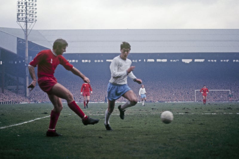 Roger Hunt of Liverpool crosses the ball as a packed Anfield looks on. The game against Burnley was notorious for some unusual crowd trouble afterwards in which the visitor’s coach was stoned. (Photo by Liverpool FC via Getty Images)