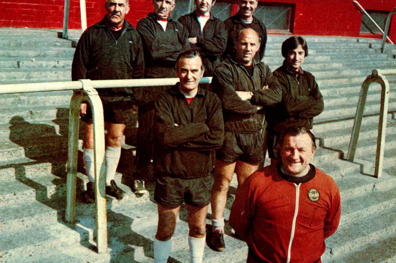 Liverpool manager Bob Paisley and the Boot Room boys pose on the steps of the old Kop. (Photo by Liverpool FC via Getty Images)