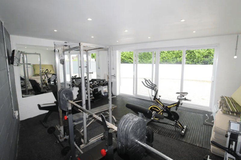 The private gym area with double doors leading outside
